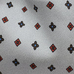 Cruciani &amp; Bella
100% Printed Silk&nbsp;
Tipped
Grey, Red and Blue Motif Tie
Handmade in Italy
8 cm x 148 cm
New Old Stock