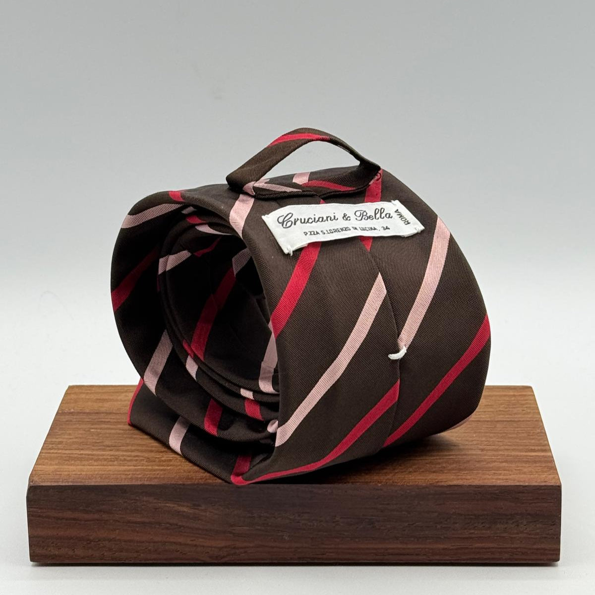 Cruciani &amp; Bella
50% Cotton 50% Silk&nbsp;

Self Tipped&nbsp;
Brown, Pink and Red stripes

Handmade in Italy
9 cm x 148 cm
New Old Stock