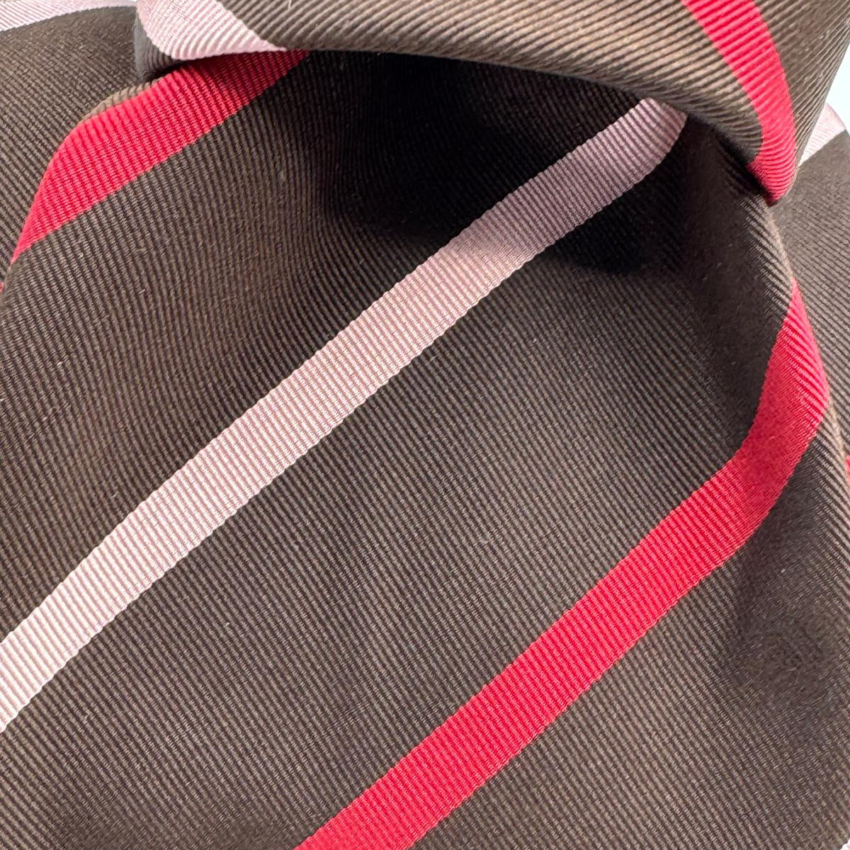Cruciani &amp; Bella
50% Cotton 50% Silk&nbsp;

Self Tipped&nbsp;
Brown, Pink and Red stripes

Handmade in Italy
9 cm x 148 cm
New Old Stock