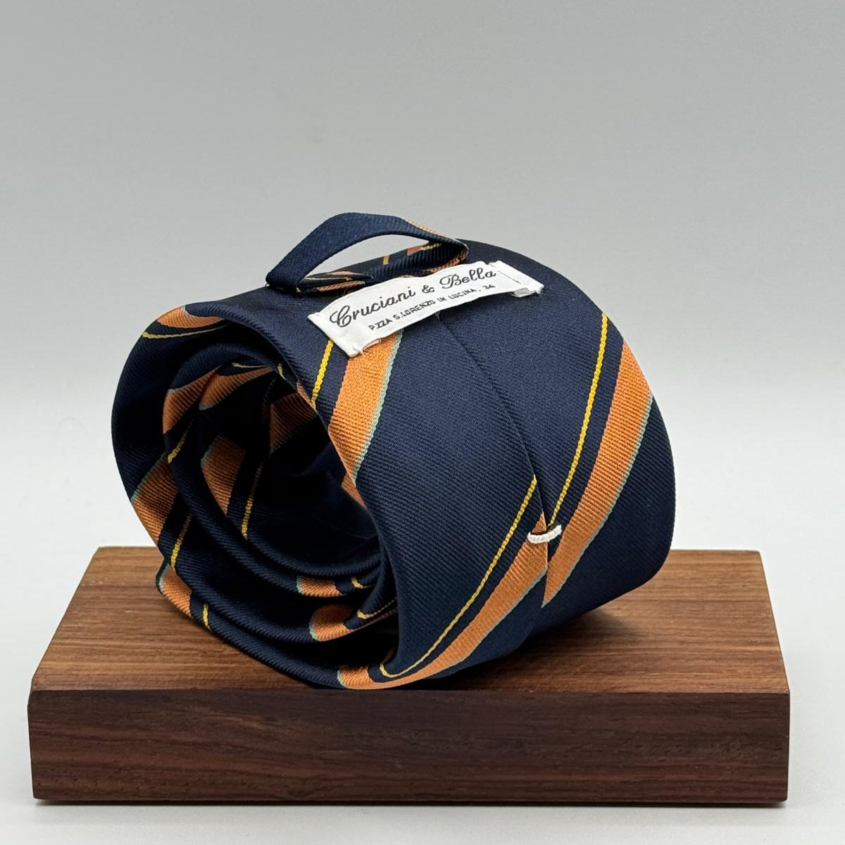 Cruciani &amp; Bella
100% Silk&nbsp;

Self Tipped&nbsp;
Bleu, Orange, Yellow and Tourquoise stripes

Handmade in Italy
9 cm x 148 cm
New Old Stock