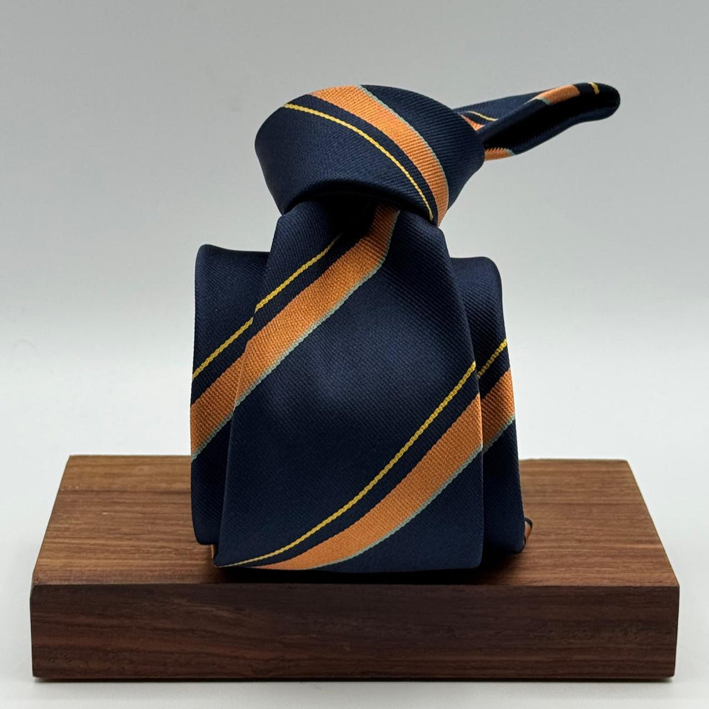 Cruciani &amp; Bella
100% Silk&nbsp;

Self Tipped&nbsp;
Bleu, Orange, Yellow and Tourquoise stripes

Handmade in Italy
9 cm x 148 cm
New Old Stock
