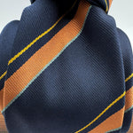 Cruciani &amp; Bella
100% Silk&nbsp;

Self Tipped&nbsp;
Bleu, Orange, Yellow and Tourquoise stripes

Handmade in Italy
9 cm x 148 cm
New Old Stock