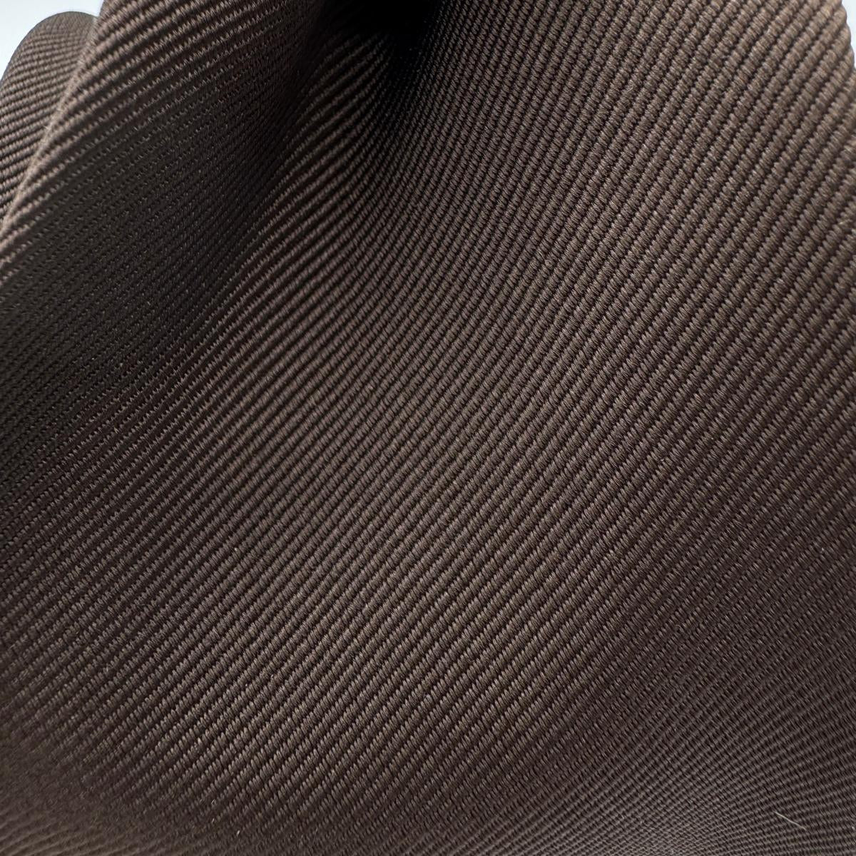 Cruciani &amp; Bella

100% Silk&nbsp;
Tipped
Brown Plain Tie
Handmade in Italy
9 cm x 148 cm
New Old Stock