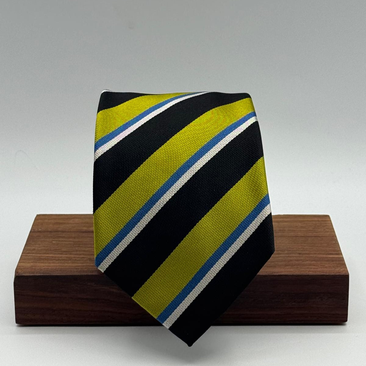 Cruciani &amp; Bella
100% Silk&nbsp;
Woven Jaquard
Self Tipped&nbsp;
Black, Apple Green, Light Blue and Silver Stripes
Handmade in Italy
9 cm x 148 cm
New Old Stock