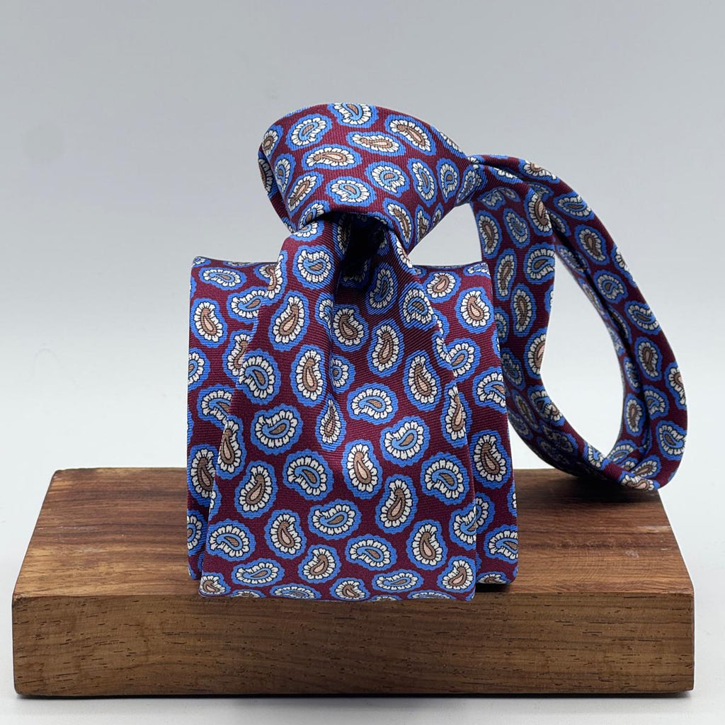 Cruciani &amp; Bella
100% Printed Silk&nbsp;
Tipped
Red Wine, Light Blue, Light Brown and White&nbsp;
Paisley Motif Tie
Handmade in Italy
8,5 cm x 148 cm
New Old Stock