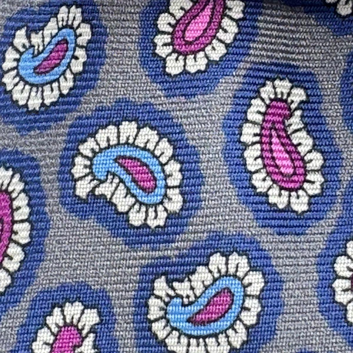 Cruciani &amp; Bella
100% Printed Silk&nbsp;
Tipped
Grey, Light Blue, Pink and White&nbsp;
Paisley Motif Tie
Handmade in Italy
8,5 cm x 148 cm
New Old Stock