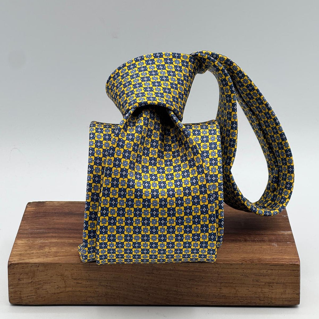 Cruciani &amp; Bella
100% Printed Silk&nbsp;
Tipped
Yellow, Light Blue, Blue and Grey&nbsp;Motif Tie
Handmade in Italy
8,5 cm x 148 cm
New Old Stock