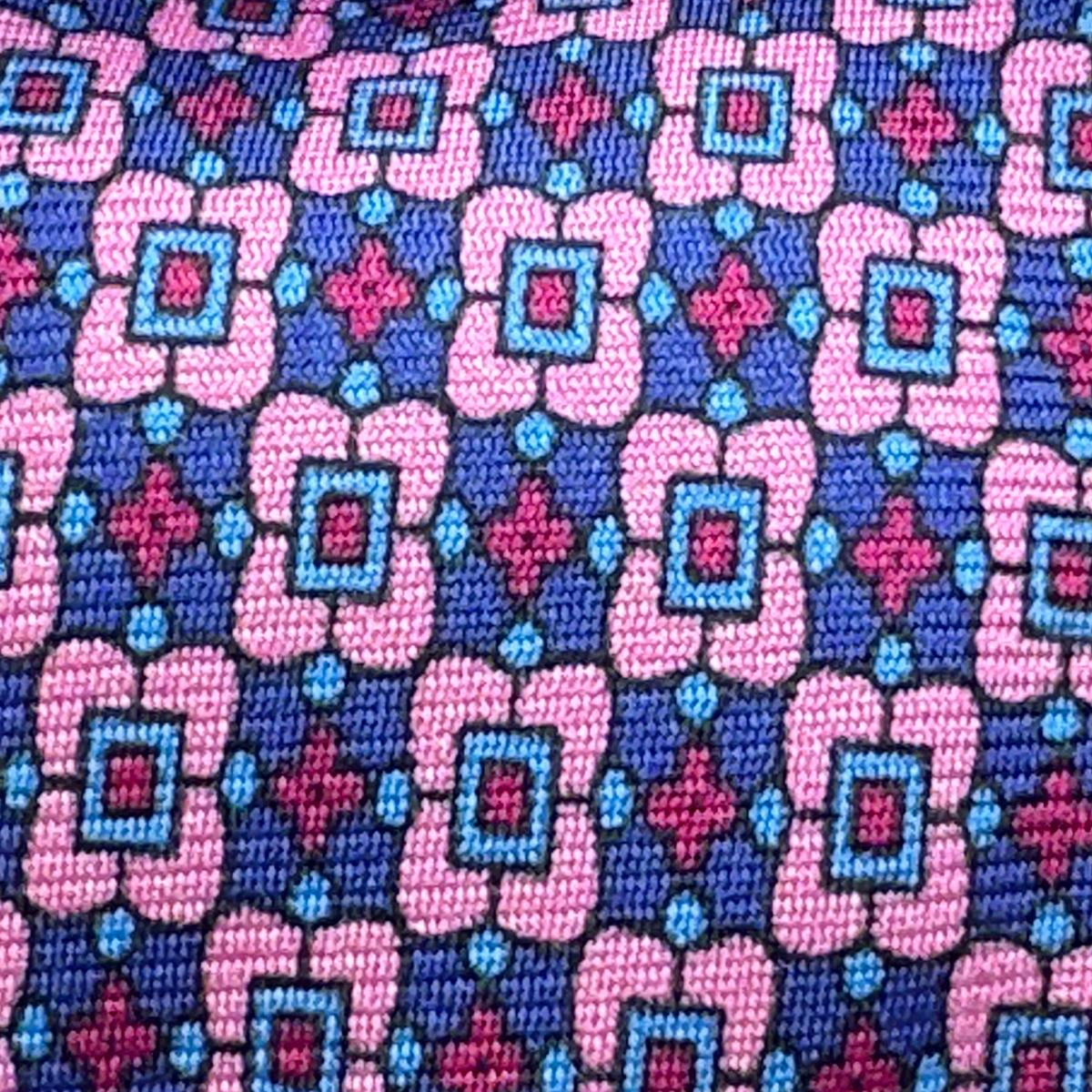 Cruciani &amp; Bella
100% Printed Silk&nbsp;
Tipped
Pink, Blue, Light Blue and Red Motif Tie
Handmade in Italy
8,5 cm x 148 cm
New Old Stock