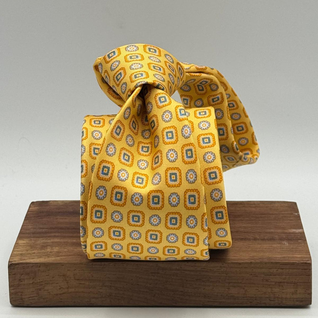 Cruciani &amp; Bella
100% Printed Silk&nbsp;
Tipped
Yellow, Light Orange and Light Blue Motif Tie
Handmade in Italy
8,5 cm x 148 cm
New Old Stock