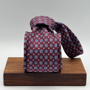 Cruciani &amp; Bella
100% Printed Silk&nbsp;
Tipped
Red Wine, Light Blue, White and Light Brown Motif Tie
Handmade in Italy
8,5 cm x 148 cm
New Old Stock