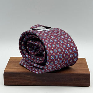 Cruciani &amp; Bella
100% Printed Silk&nbsp;
Tipped
Red Wine, Light Blue, White and Light Brown Motif Tie
Handmade in Italy
8,5 cm x 148 cm
New Old Stock