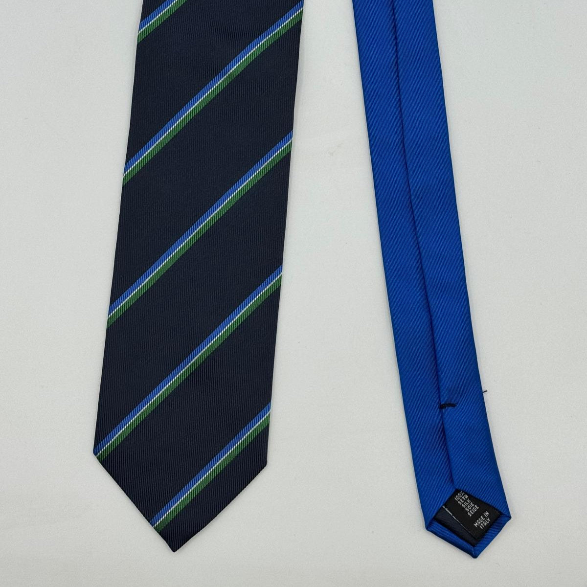 Cruciani &amp; Bella
100% Woven Silk&nbsp;

Crazy Regimental Tie
Tipped&nbsp;
Blue, Light Blue, Green, White Stripes

Handmade in Italy
8,5 cm x 148 cm
New Old Stock