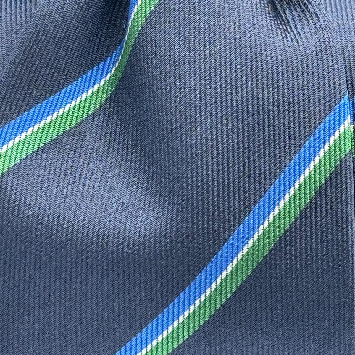 Cruciani &amp; Bella
100% Woven Silk&nbsp;

Crazy Regimental Tie
Tipped&nbsp;
Blue, Light Blue, Green, White Stripes

Handmade in Italy
8,5 cm x 148 cm
New Old Stock