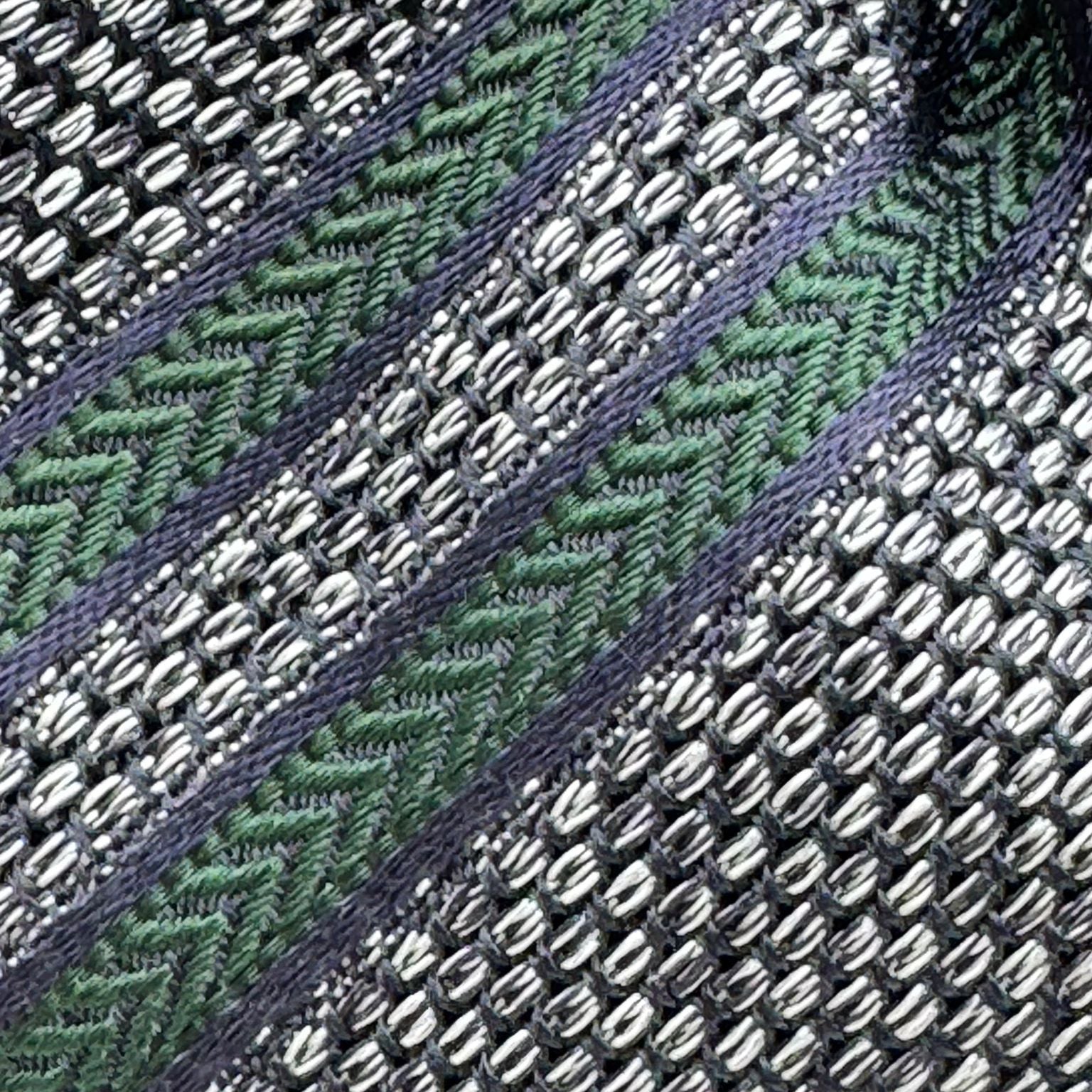Drake's for Cruciani &amp; Bella
100%&nbsp; Woven Silk
Tipped
Grey Melange, Dark Blue and Green Stripes
Handmade in London, England
8 cm x 150 cm