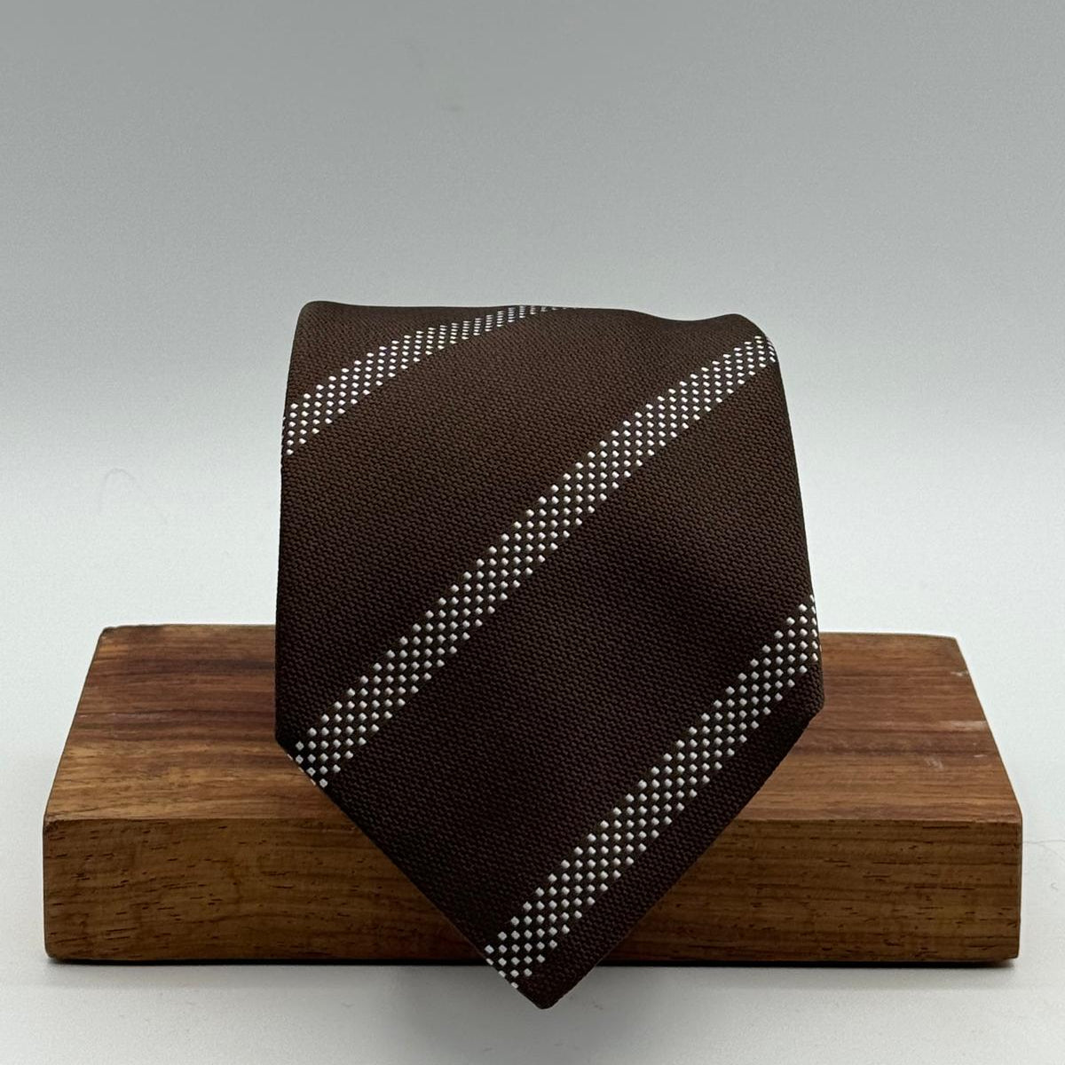 Cruciani &amp; Bella

100% Silk&nbsp;
Self Tipped
Brown and Light Blue Stripe&nbsp;
Handmade in Italy
9 cm x 148 cm
New Old Stock