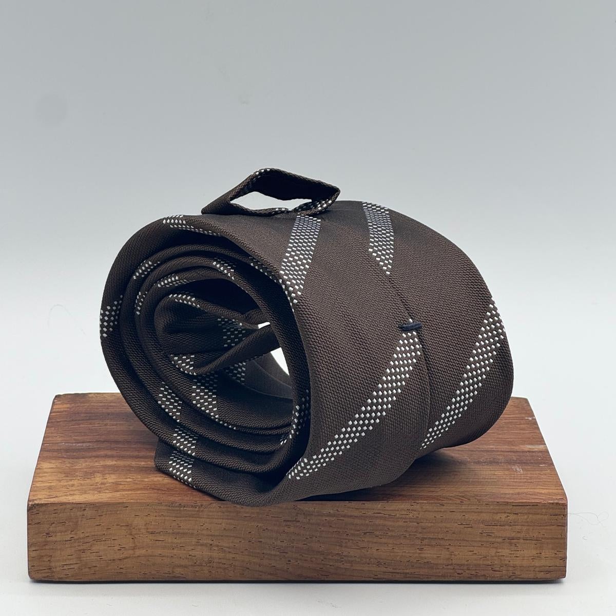 Cruciani &amp; Bella

100% Silk&nbsp;
Self Tipped
Brown and Light Blue Stripe&nbsp;
Handmade in Italy
9 cm x 148 cm
New Old Stock