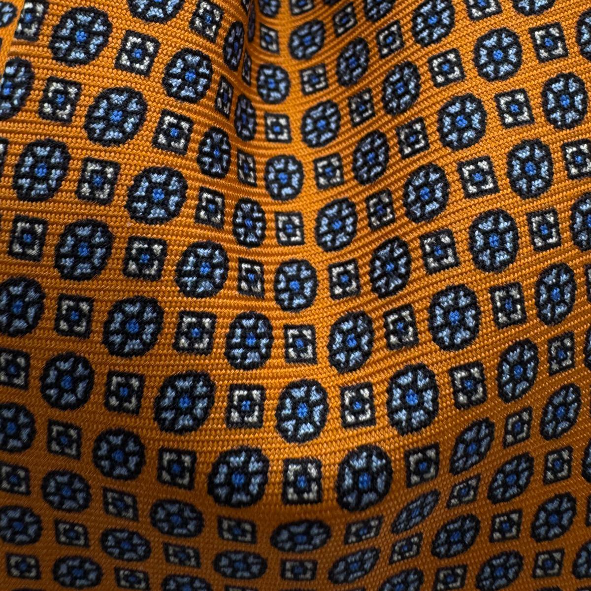 Cruciani &amp; Bella
100% Printed Silk&nbsp;
Tipped
Orange and Light Blue Motif Tie
Handmade in Italy
8 cm x 148 cm
New Old Stock