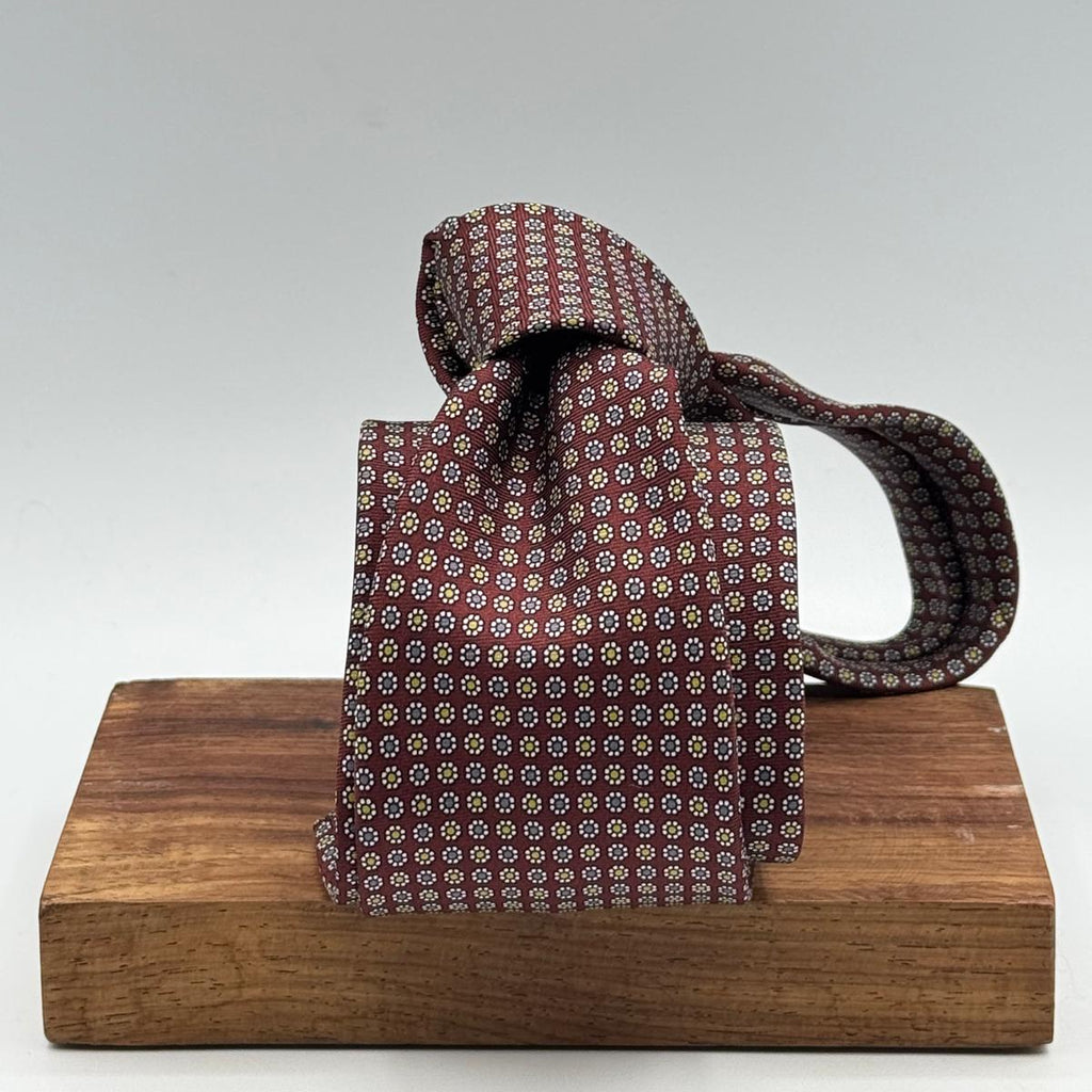 Cruciani &amp; Bella
100% Printed Silk&nbsp;
Tipped
Red Wine, Grey, Yellow, and White Floral Motif Tie
Handmade in Italy
8 cm x 148 cm
New Old Stock