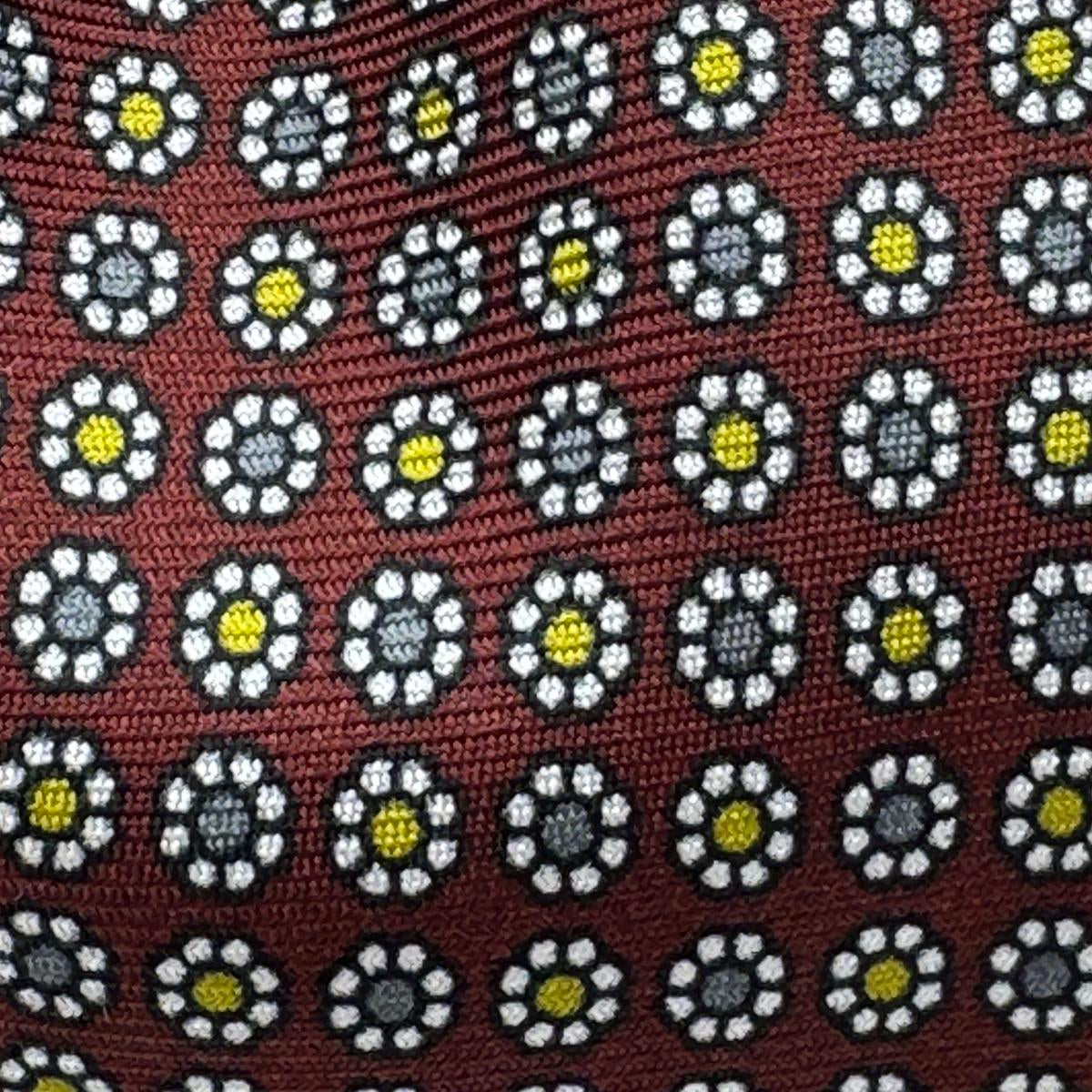 Cruciani &amp; Bella
100% Printed Silk&nbsp;
Tipped
Red Wine, Grey, Yellow, and White Floral Motif Tie
Handmade in Italy
8 cm x 148 cm
New Old Stock