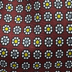 Cruciani &amp; Bella
100% Printed Silk&nbsp;
Tipped
Red Wine, Grey, Yellow, and White Floral Motif Tie
Handmade in Italy
8 cm x 148 cm
New Old Stock