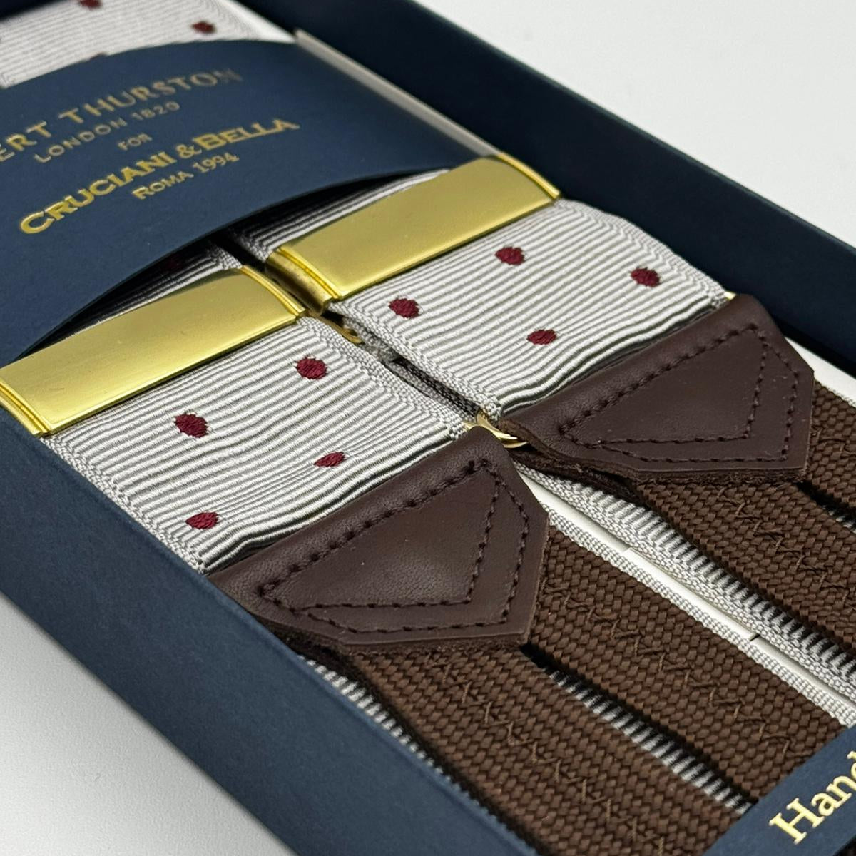 Albert Thurston for Cruciani &amp; Bella
Made in England
Adjustable Sizing
40 mm Woven Barathea
Dirty White, Brick Dots
Braid ends
Y-Shaped
Gold Fittings
Size Multifit Adjustable&nbsp;Length:&nbsp;115cm (= 45 inch) Maximum