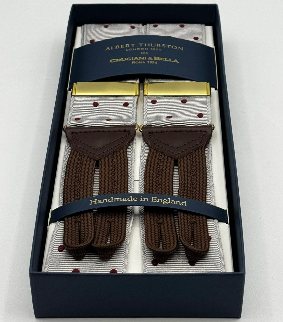 Albert Thurston for Cruciani &amp; Bella
Made in England
Adjustable Sizing
40 mm Woven Barathea
Dirty White, Brick Dots
Braid ends
Y-Shaped
Gold Fittings
Size Multifit Adjustable&nbsp;Length:&nbsp;115cm (= 45 inch) Maximum