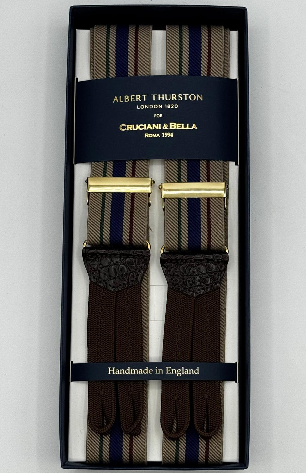 Albert Thurston for Cruciani &amp; Bella
Made in England
Adjustable Sizing
35 mm elastic Hazelnut, Red, Blue and Grey Stripes braces
Braid ends
Y-Shaped
Gold Fittings
Size Multifit Adjustable&nbsp;Length:&nbsp;115cm (= 45 inch) Maximum