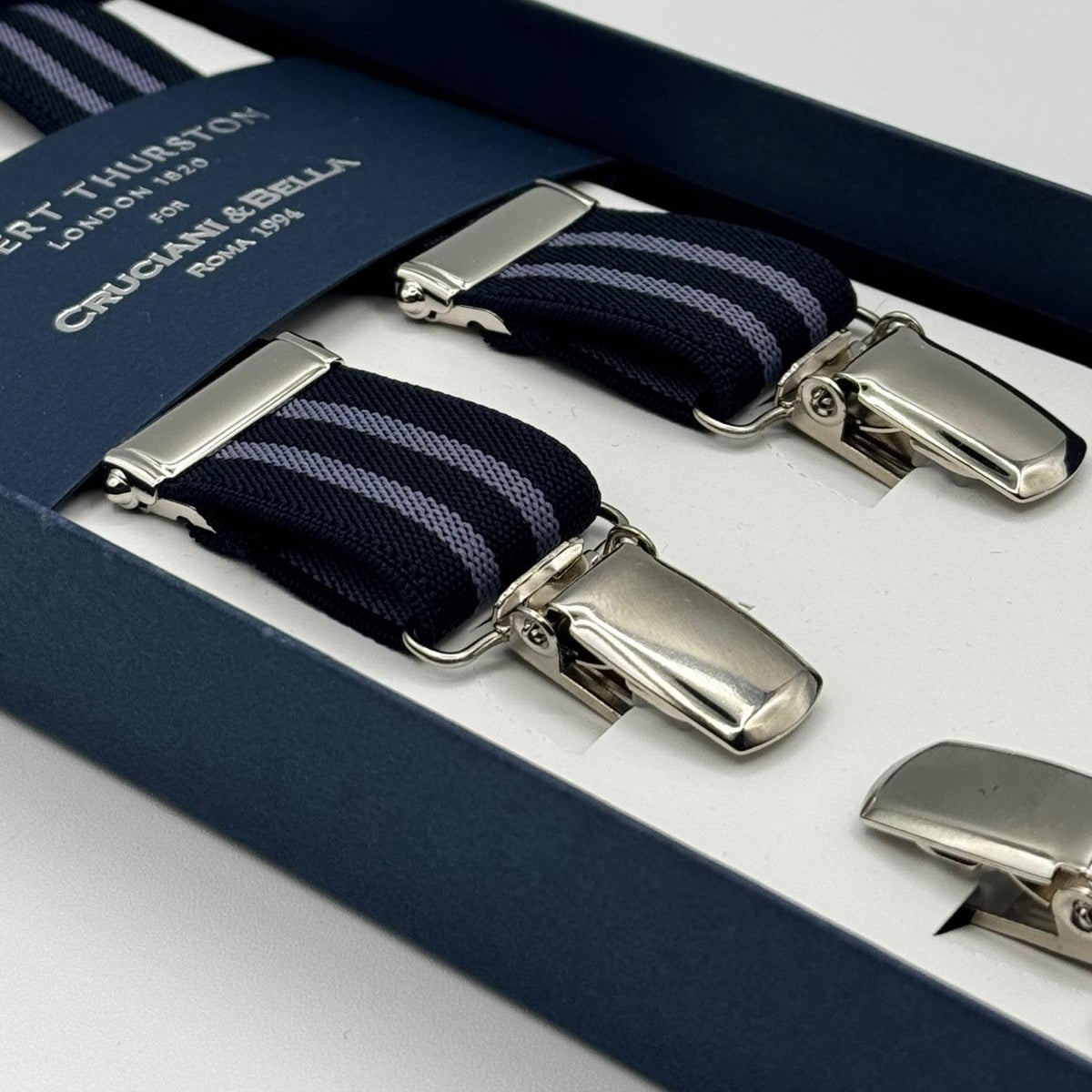 Albert Thurston for Cruciani &amp; Bella

Made in England
Clip on
Adjustable Sizing
25 mm elastic braces
Blue and Violet Stripes
X-Shaped
Nickel Fittings
Size Multifit Adjustable&nbsp;Length:&nbsp;115cm (= 45 inch) Maximum