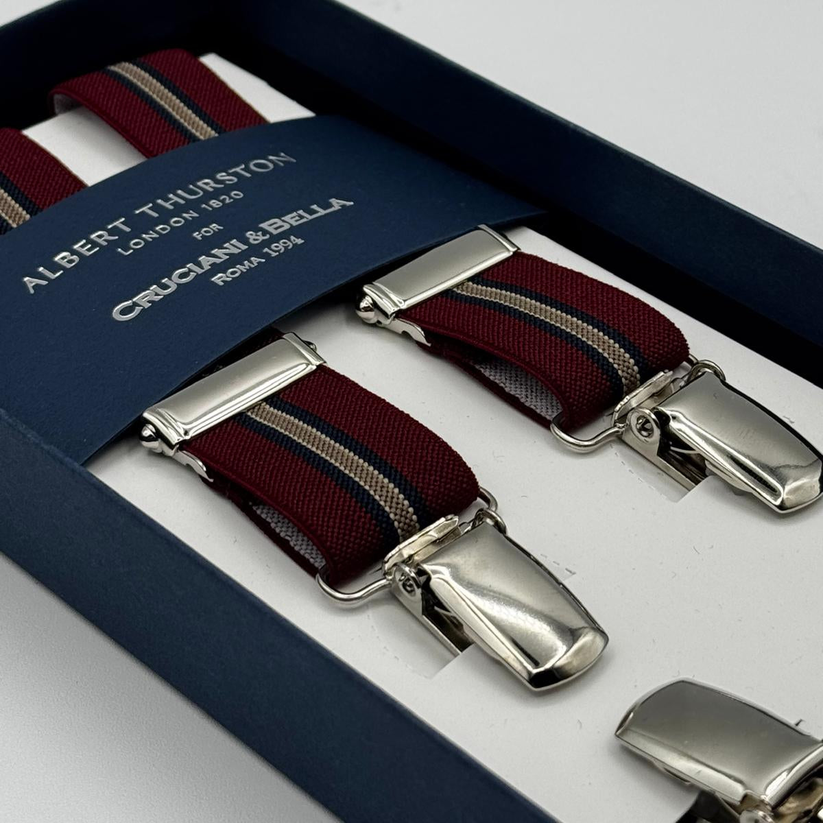Albert Thurston for Cruciani &amp; Bella

Made in England
Clip on
Adjustable Sizing
25 mm elastic braces
Blue, Red Wine and Azelnut Stripes
X-Shaped
Nickel Fittings
Size Multifit Adjustable&nbsp;Length:&nbsp;115cm (= 45 inch) Maximum