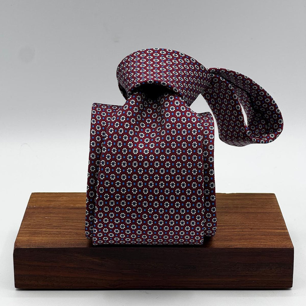 Cruciani &amp; Bella
100% Printed Silk&nbsp;
Tipped
Red Wine, Light Blue and Off White Motif Tie
Handmade in Italy
8 cm x 148 cm
New Old Stock