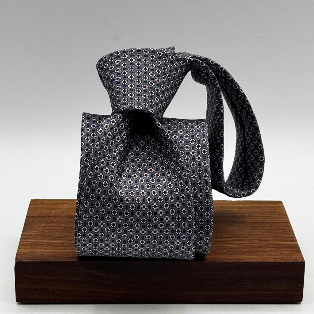 Cruciani &amp; Bella
100% Printed Silk&nbsp;
Tipped
Grey, Red and Off White Motif Tie
Handmade in Italy
8 cm x 148 cm
New Old Stock
