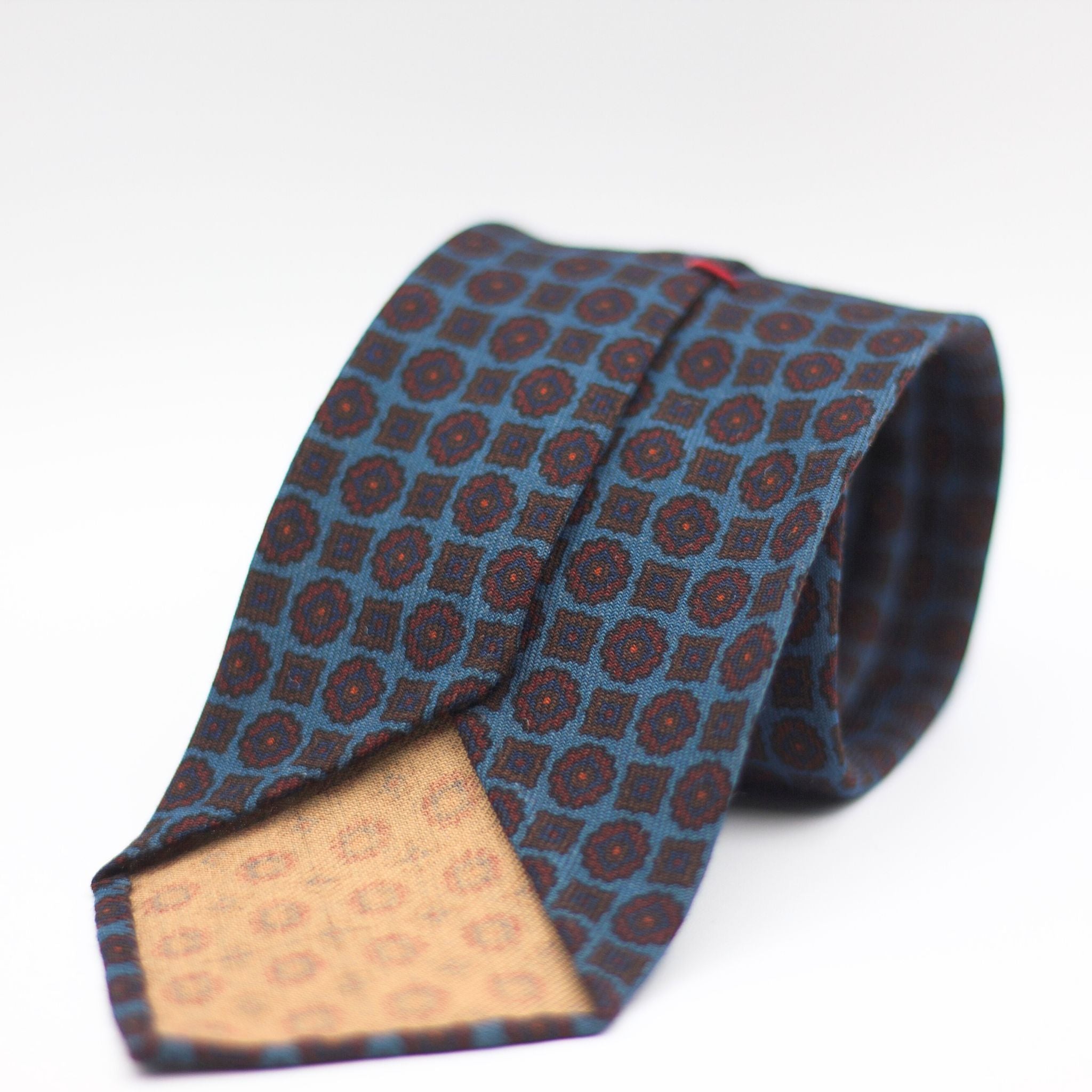 Cruciani & Bella 100%  Printed Wool  Unlined Hand rolled blades Light Blue, Burgundy and Brown Motifs Tie Handmade in Italy 8 cm x 150 cmCruciani & Bella 100%  Printed Wool  Unlined Hand rolled blades Light Blue, Burgundy and Brown Motifs Tie Handmade in Italy 8 cm x 150 cm