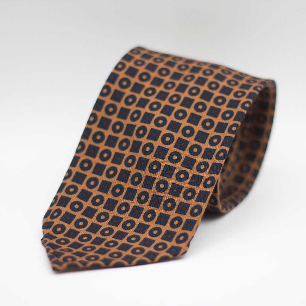 Cruciani & Bella 100%  Printed Wool  Unlined Hand rolled blades Light Brown, Blue and Burgundy Motifs Tie Handmade in Italy 8 cm x 150 cm