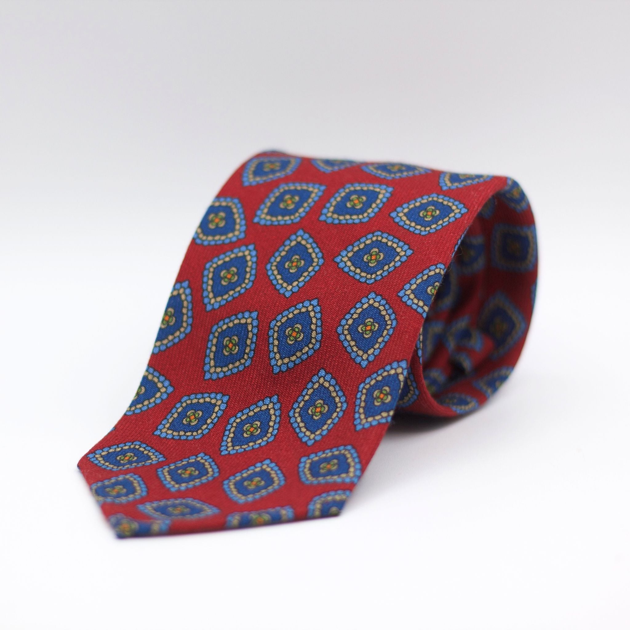 Cruciani & Bella 100%  Printed Wool  Unlined Hand rolled blades Red, Blue, light Blue and light beige Motif Tie Handmade in Italy 8 cm x 150 cm