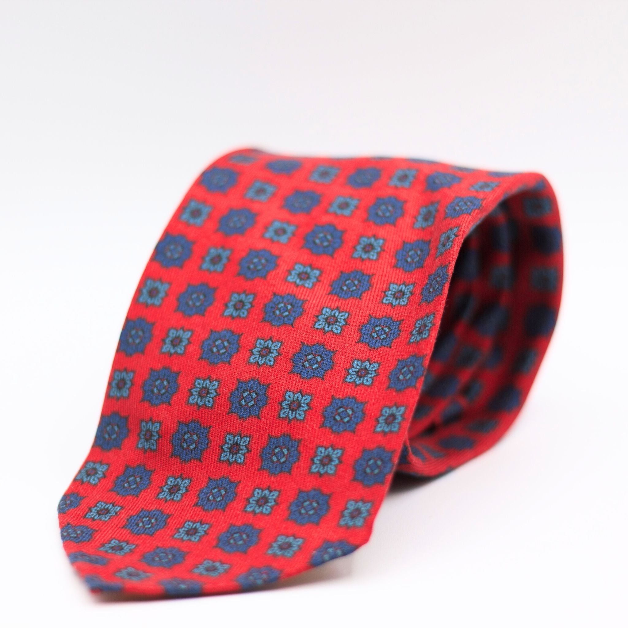 Cruciani & Bella 100%  Printed Wool  Unlined Hand rolled blades  Red, Blue and Light Blue Motifs Tie Handmade in Italy 8 cm x 150 cm