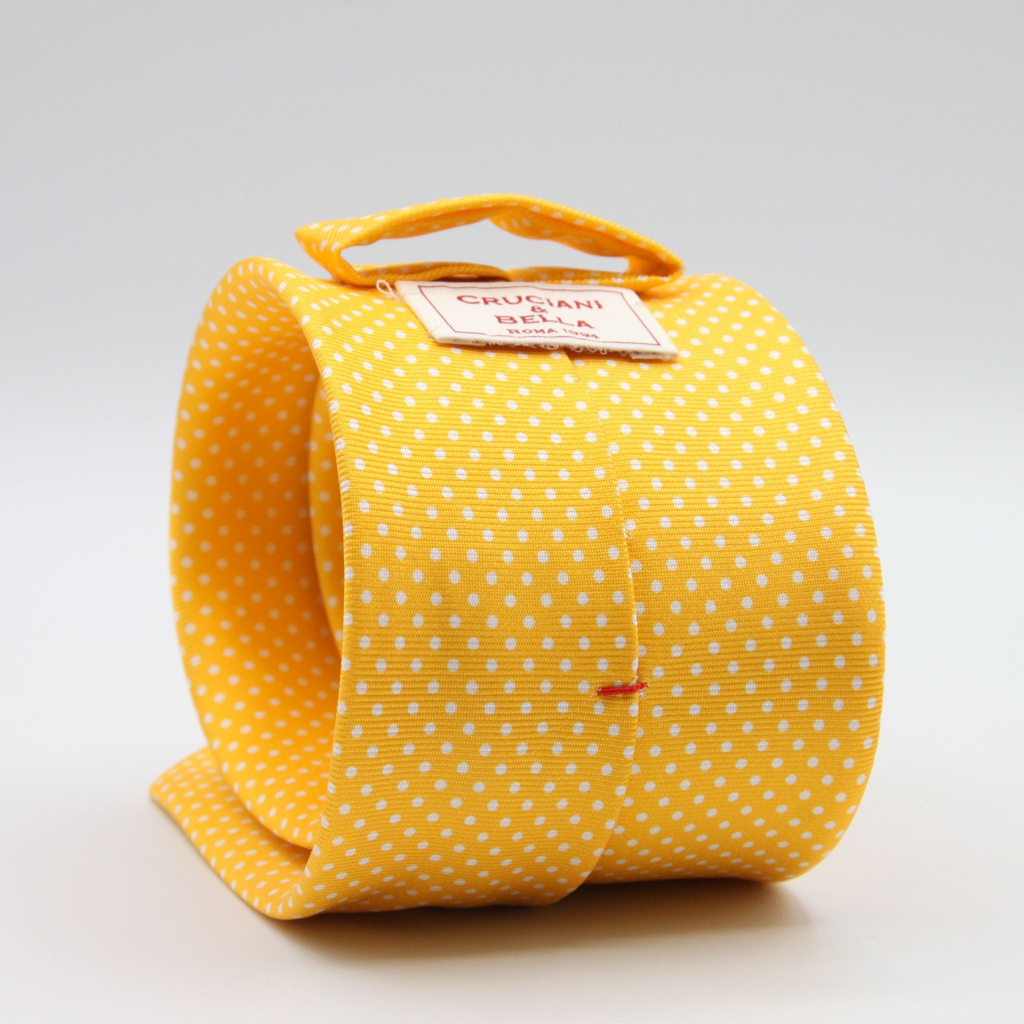 Cruciani &amp; Bella
100% Printed Silk

Self-Tipped
Yellow and White Pindots Tie&nbsp;
Handmade in Rome, Italy.

8 cm x 150 cm
#8855