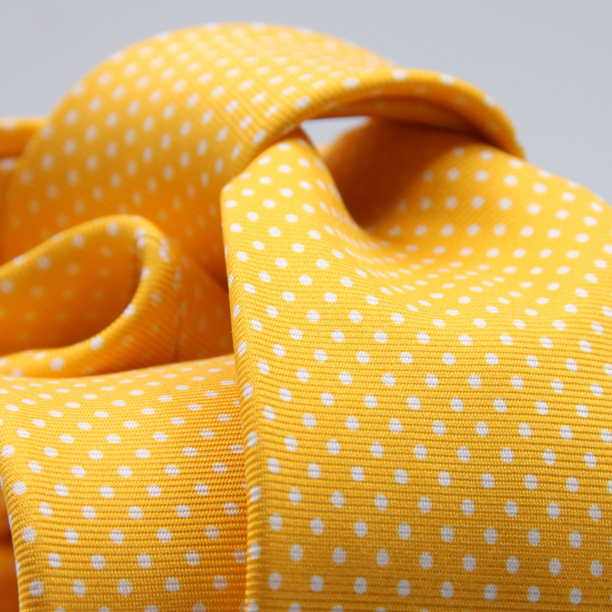 Cruciani &amp; Bella
100% Printed Silk

Self-Tipped
Yellow and White Pindots Tie&nbsp;
Handmade in Rome, Italy.

8 cm x 150 cm
#8855