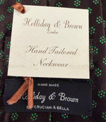 Holliday &amp; Brown Vintage
Woven Jacquard
100% Silk&nbsp;
Tipped&nbsp;
Brown Tie
Green Motf
Handmade in England
9 cm x 146 cm
#6603