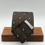 Cruciani &amp; Bella
100% Silk&nbsp;
Woven Jaquard
Self Tipped&nbsp;
Brown Tie with a Blue Cat
Handmade in Italy
9cm x 148 cm
New Old Stock
#10197