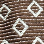 Drake's for Cruciani &amp; Bella
100% Silk
Tipped&nbsp;
Light Brown Tie
White Motif
Handmade in England
9,5 cm x 146 cm
#6518