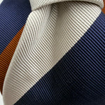 Cruciani &amp; Bella
50% Cotton 50% Silk

Tipped&nbsp;
Bleu, Brown and Off White stripes

Handmade in Italy
9 cm x 148 cm
New Old Stock
