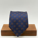 Drake's for Cruciani &amp; Bella
100%&nbsp; Woven Silk
Tipped
Blue and Brown Geometric motif Tie
Handmade in London, England
9 cm x 150 cm