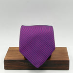 Drake's for Cruciani &amp; Bella
100%&nbsp; Woven Silk
Tipped
Purple and Black motif Stripes Tie
Handmade in London, England
9,5 cm x 150 cm