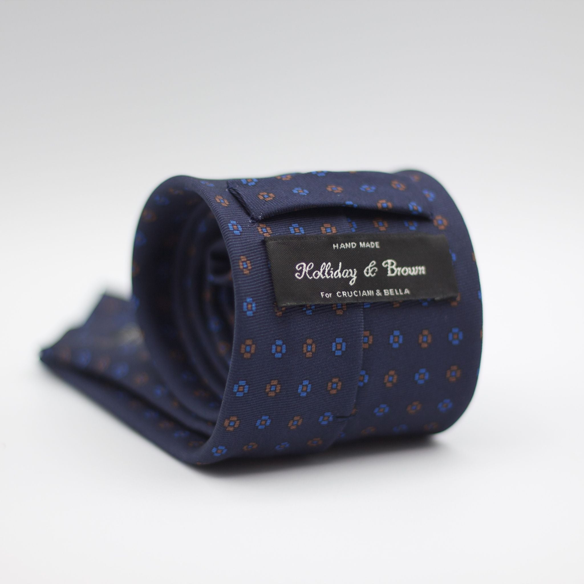 Holliday & Brown for Cruciani & Bella 100% printed Silk Self Tipped Navy with Brown and Light Blue motif tie  Handmade in Italy 8 cm x 150 cm