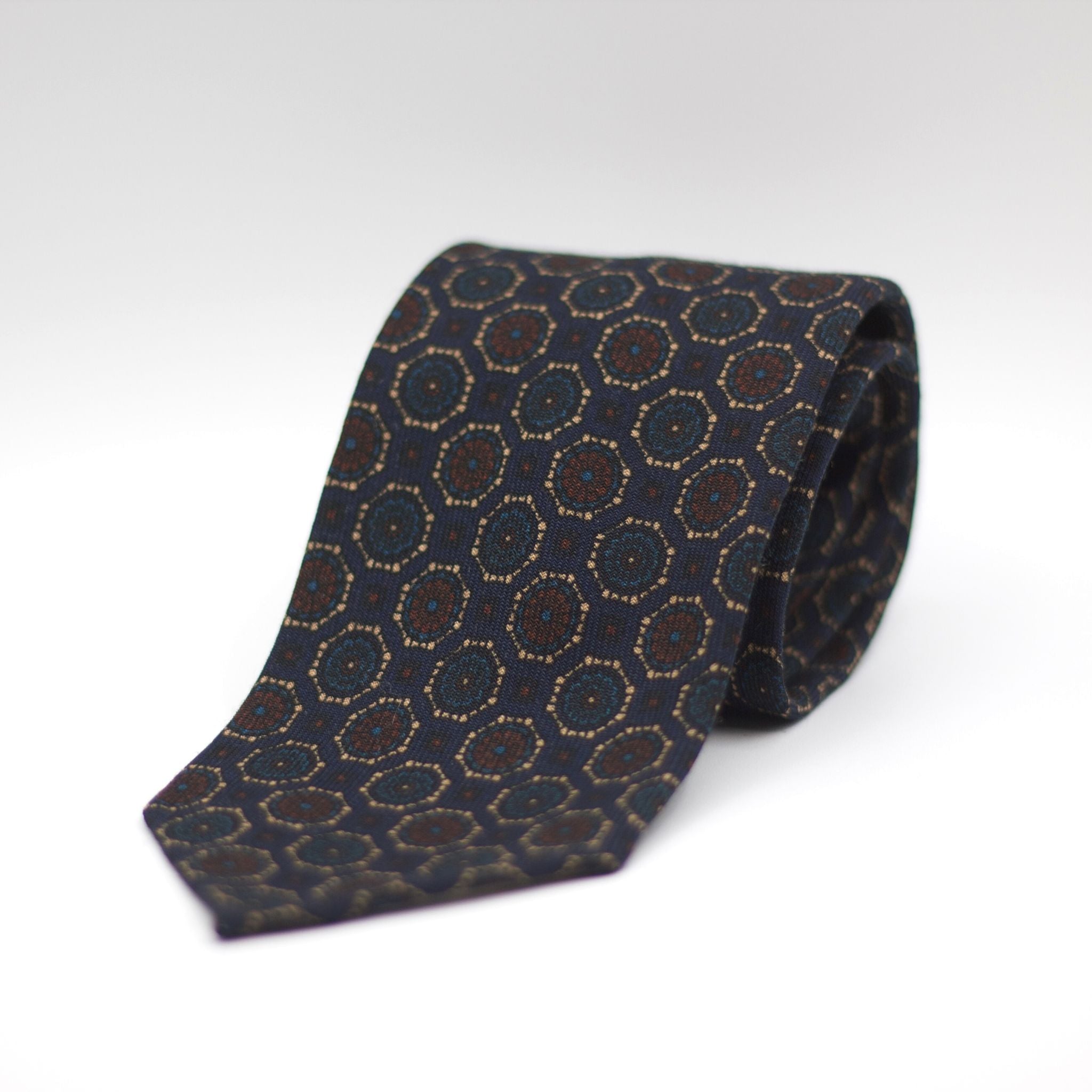 Cruciani & Bella 100%  Printed Wool  Unlined Hand rolled blades Blue, Brown, Beige and light Blue  Motif Tie Handmade in Italy 8 cm x 150 cm #7271