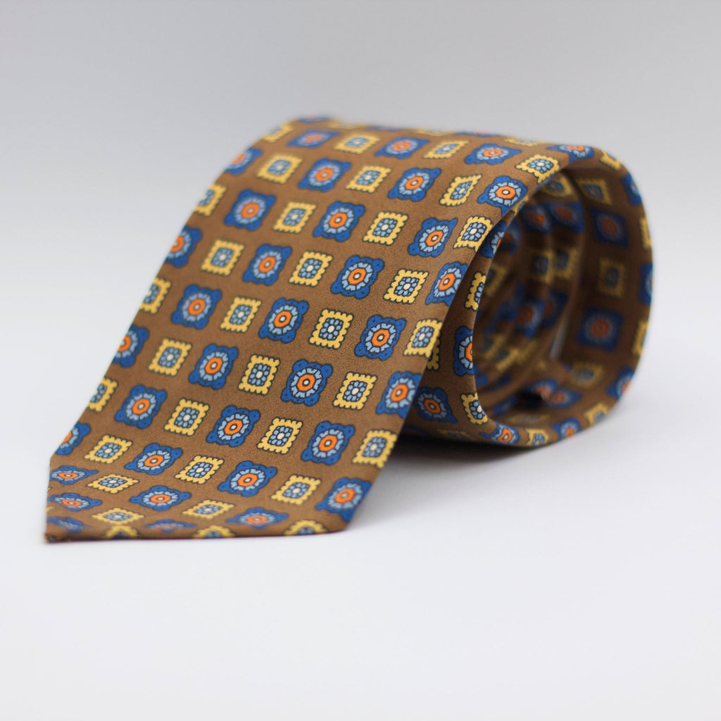 Cruciani & Bella  100% Printed Madder Silk  Italian fabric  Unlined tie Khaki, Blue, light Blue, Yellow and Orange motif Handmade in Italy 8 cm x 150 cm