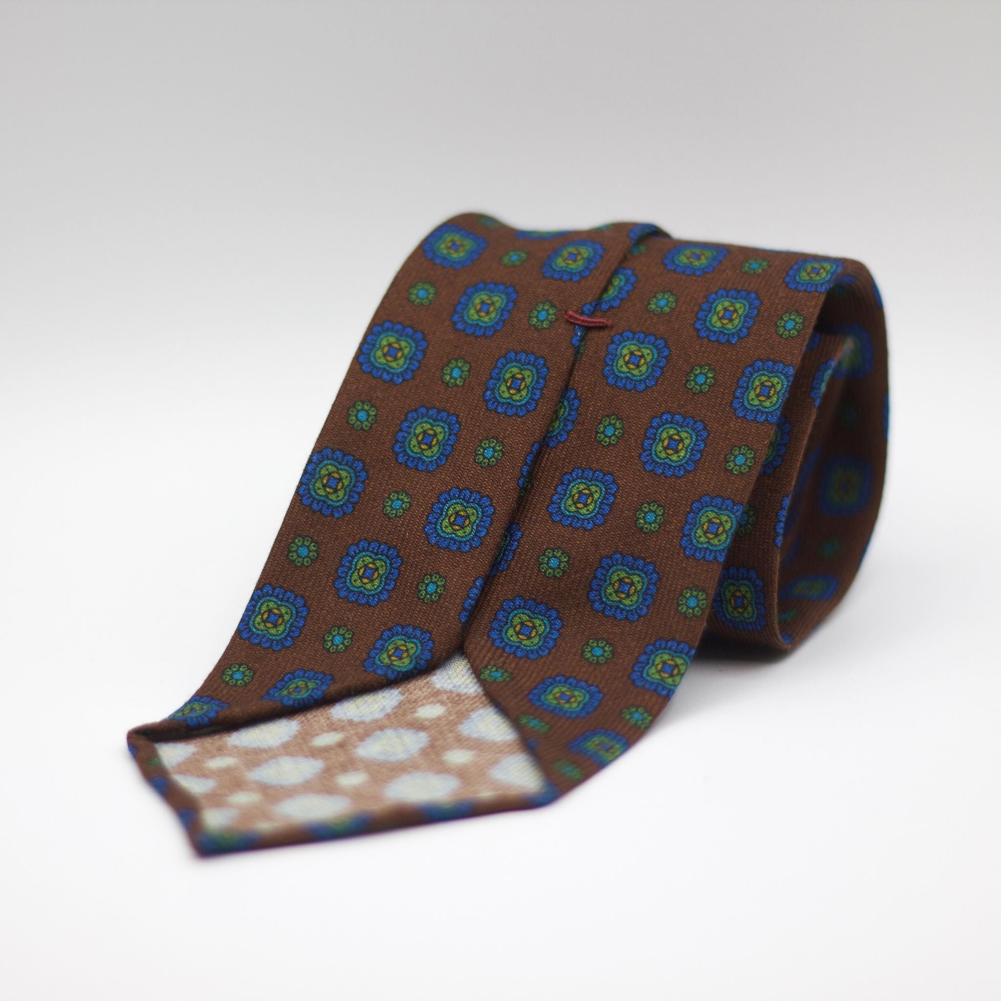 Cruciani & Bella 100%  Printed Wool  Unlined Hand rolled blades Brown, Green, Blue and Yellow  Motif Tie Handmade in Italy 8 cm x 150 cm