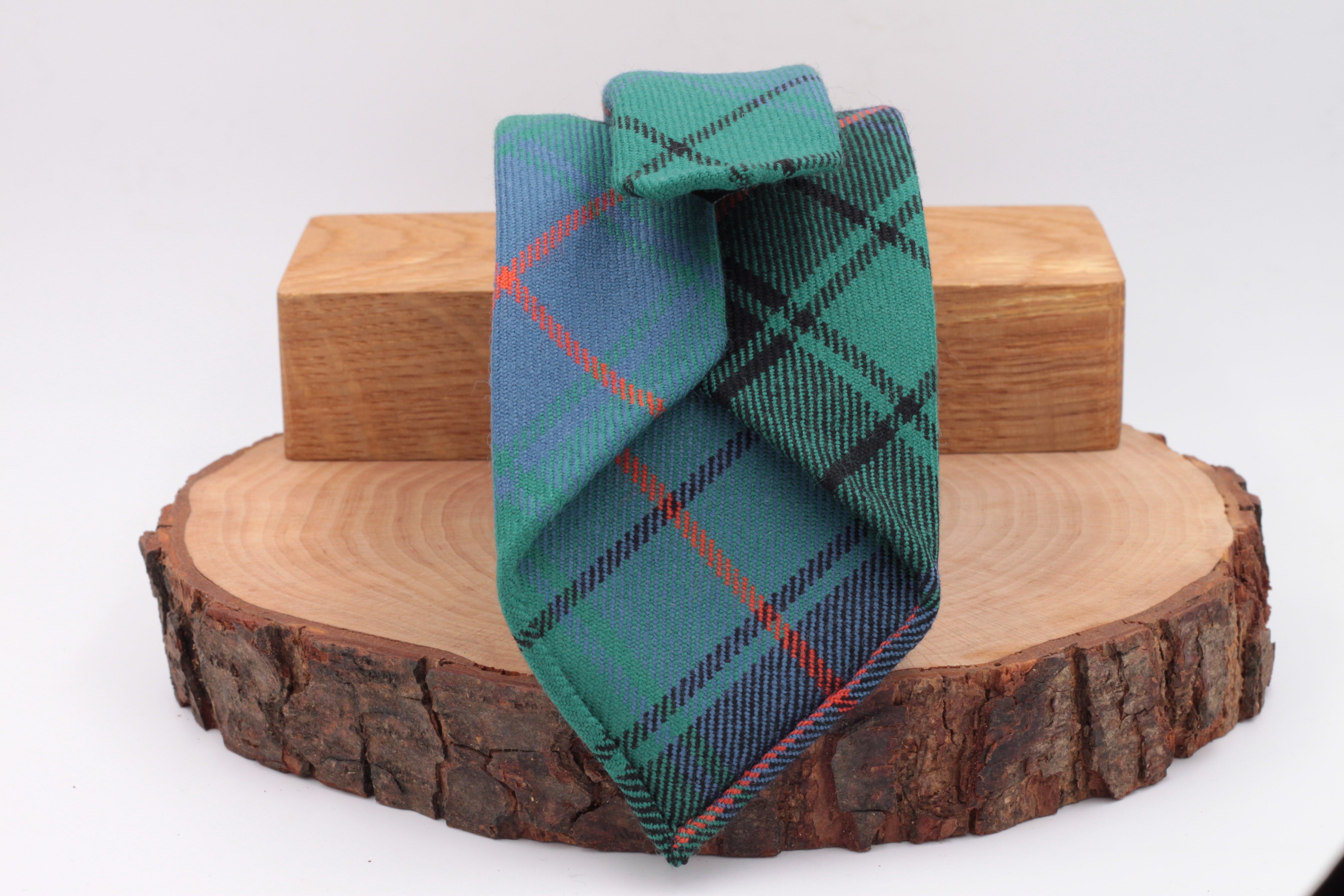 Green, orange, light blue and black tartan tie