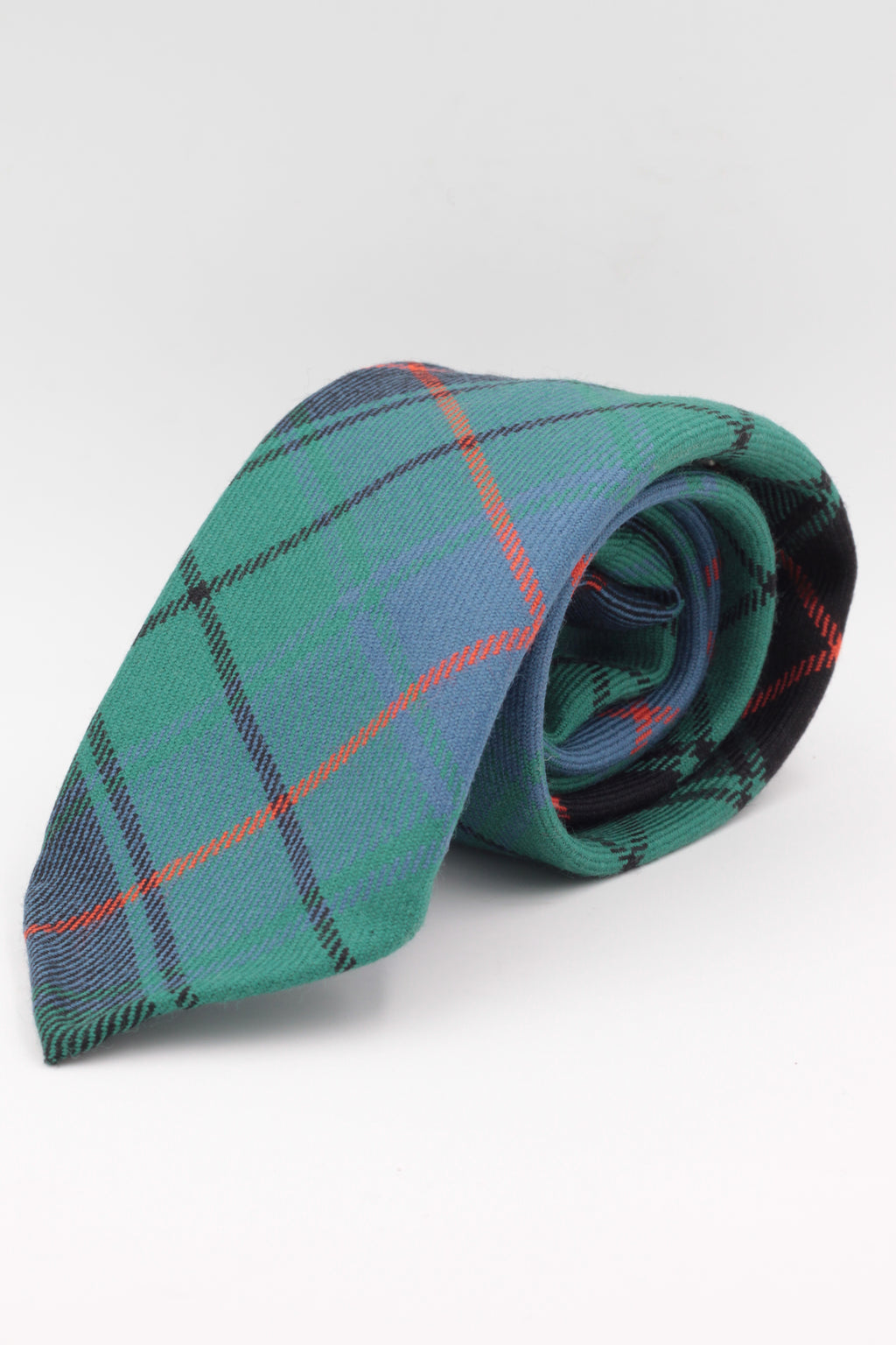 Green, orange, light blue and black tartan tie