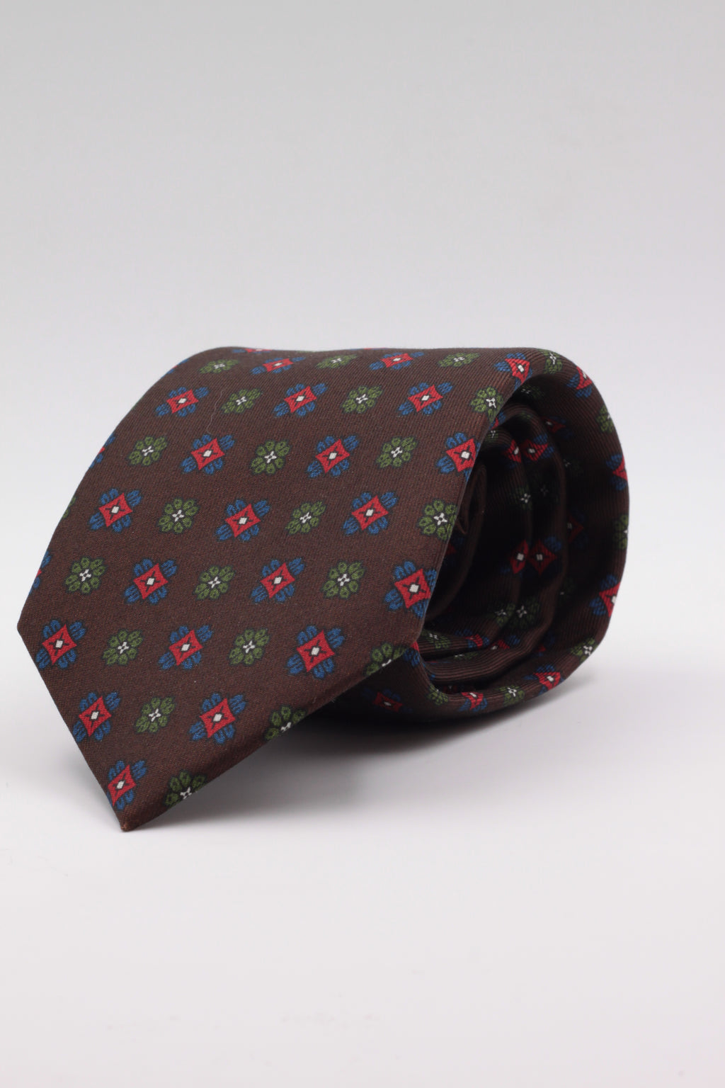 Brown, green, red and royal blue motif tie